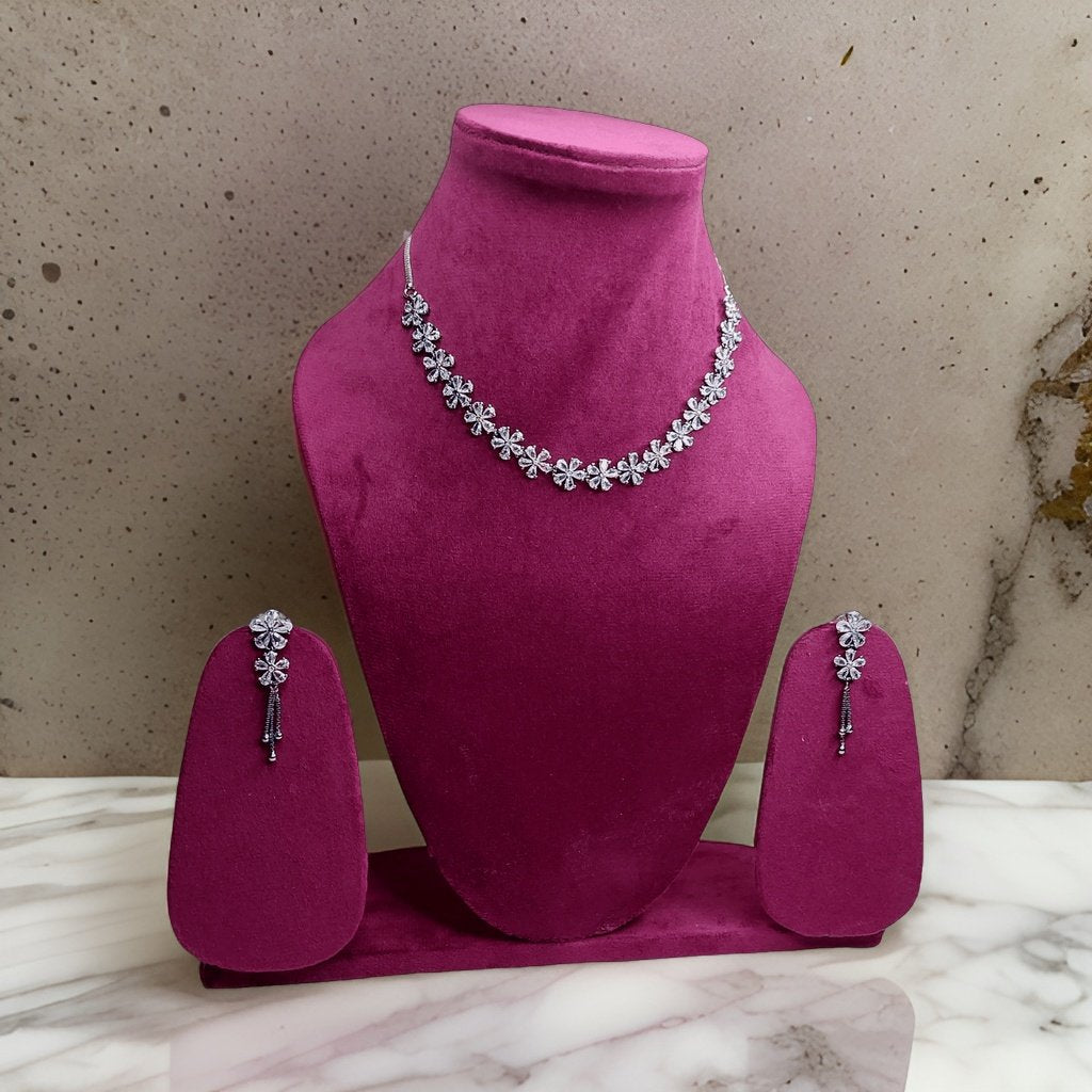Add a touch of whimsy to your look with our Butler and Wilson Daisy Necklace. This playful piece features daisy-shaped charms that add a cheerful vibe to any ensemble. The adjustable length ensures a comfortable fit, making it suitable for all occasions.