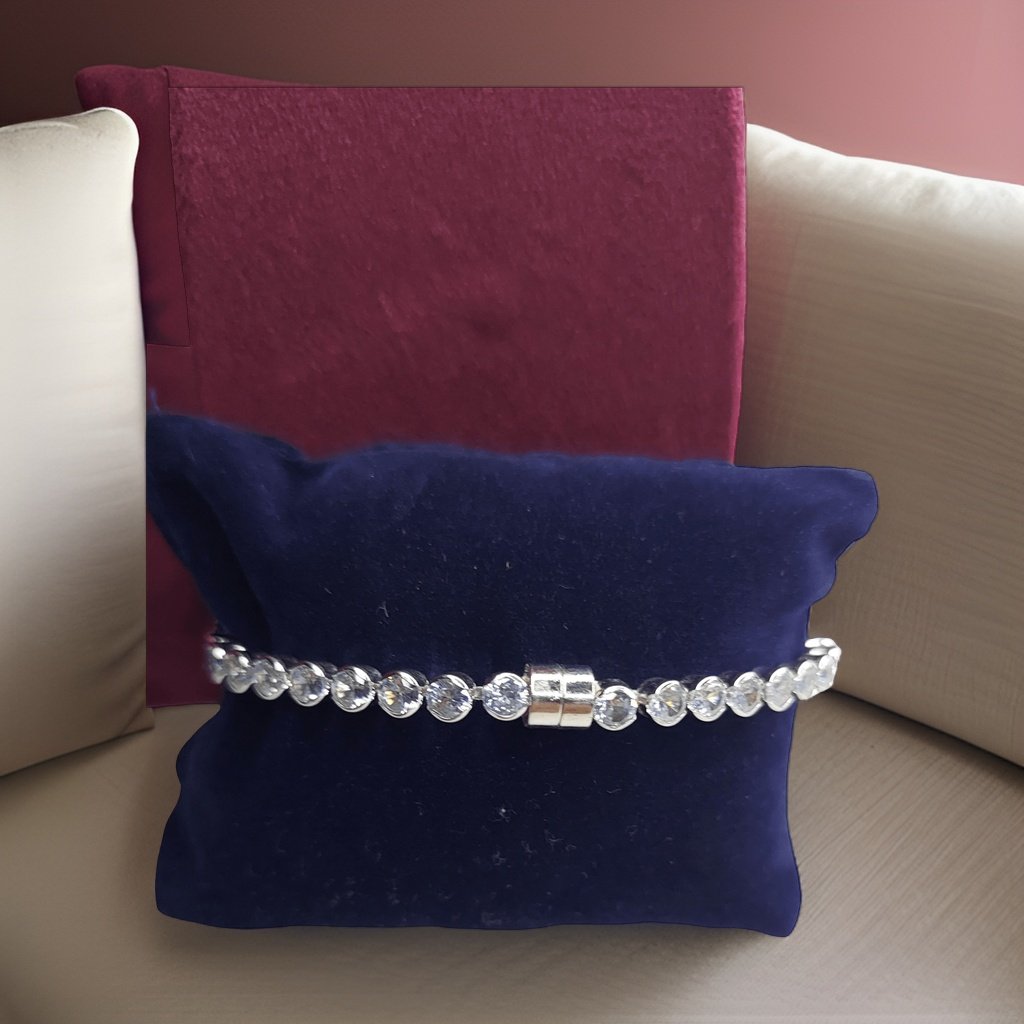 Make a fashion statement with our Circle Shaped Diamond Look Like Bracelet. With its eye-catching circular design and diamond-like details, this bracelet adds a touch of elegance to any look. The adjustable length ensures a comfortable fit, making it suitable for all occasions.