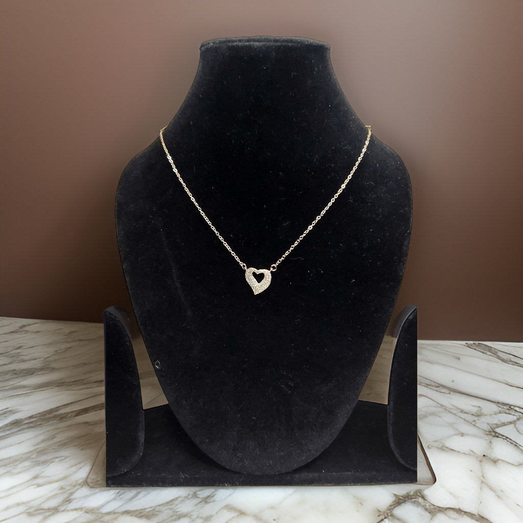 Add a touch of romance to your look with our <em>Elegant Heart Pendant</em>. This stunning piece features an elegant heart-shaped pendant that symbolizes love and affection. The adjustable chain ensures a comfortable fit, making it suitable for all occasions.