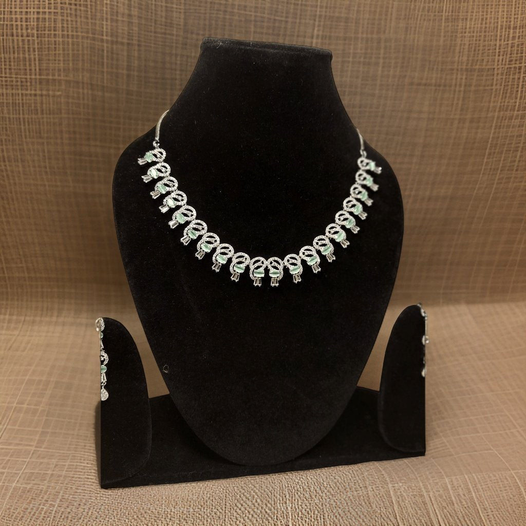 Elevate your look with our Premium American Diamond Necklace. This luxurious piece features high-quality American diamond accents that add instant glamour to any ensemble. The adjustable chain ensures a perfect fit, making it suitable for all necklines.