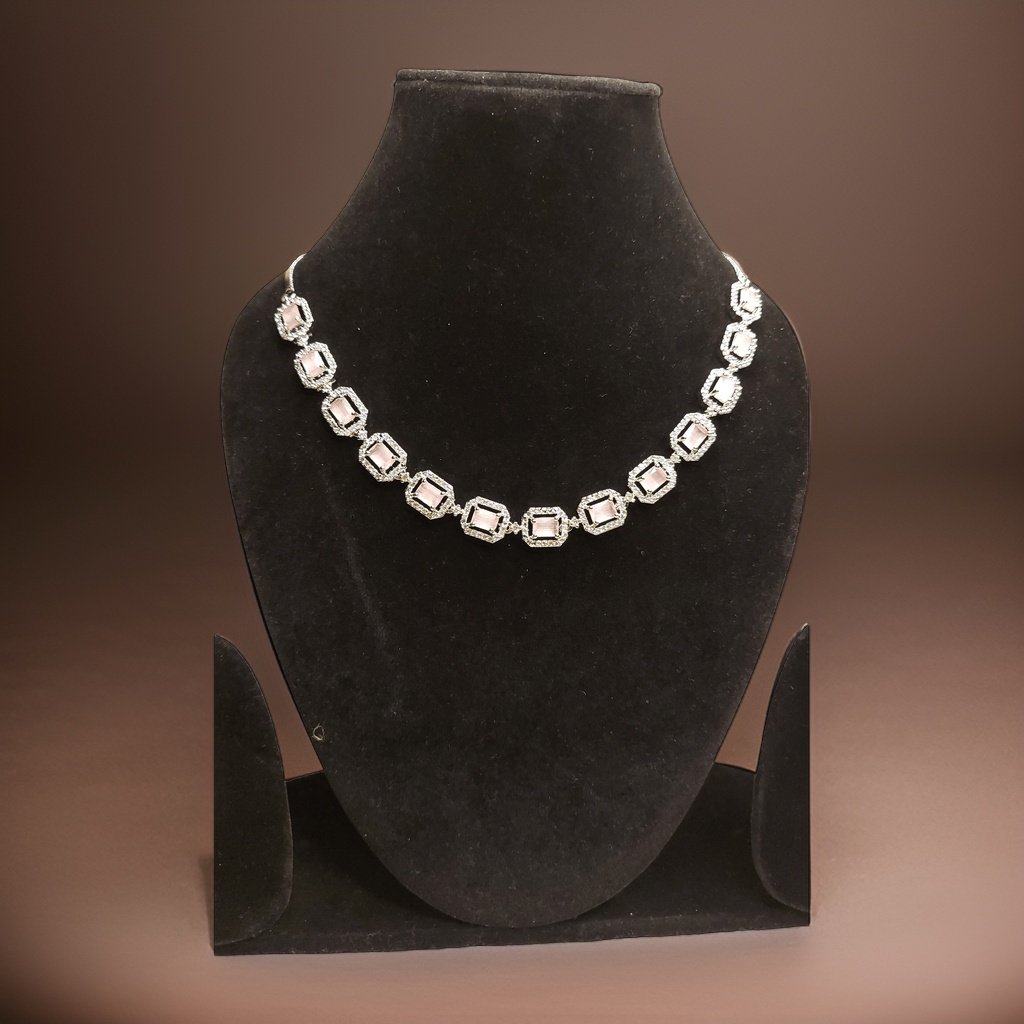 Add a touch of sparkle to your neckline with our Round Cluster American Diamond Necklace. This elegant piece features a cluster of sparkling American diamond accents that catch the light beautifully. The adjustable chain ensures a perfect fit, making it suitable for all necklines.