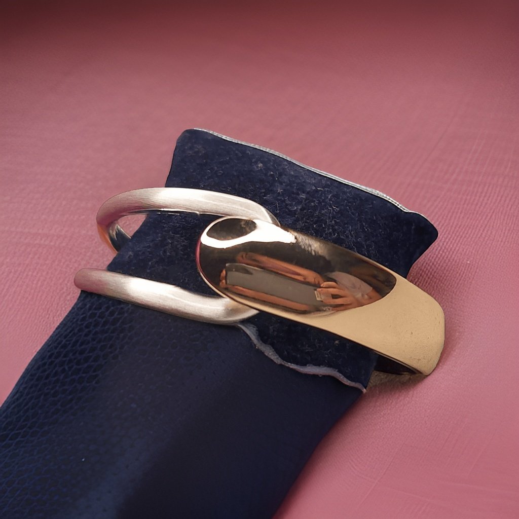 Add a touch of glamour to your ensemble with our Sterling Silver and Golden Look Bracelet. This versatile accessory features a combination of sterling silver and golden accents for a chic look. The adjustable length ensures a comfortable fit, making it suitable for all occasions.
