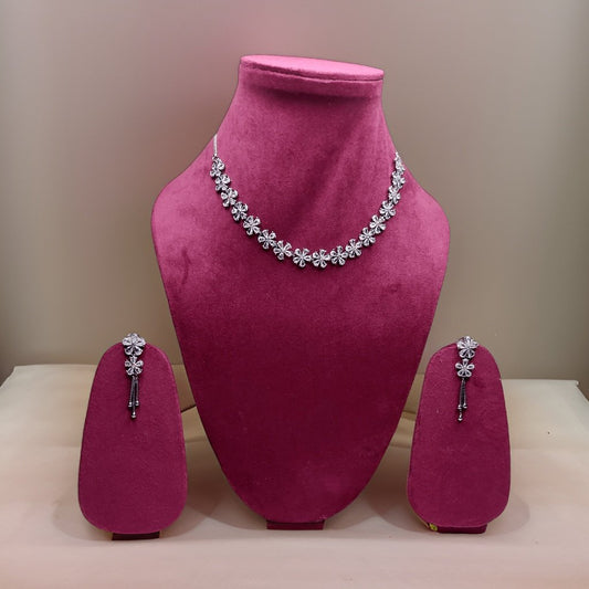 Add a touch of whimsy to your look with our Butler and Wilson Daisy Necklace. This playful piece features daisy-shaped charms that add a cheerful vibe to any ensemble. The adjustable length ensures a comfortable fit, making it suitable for all occasions.