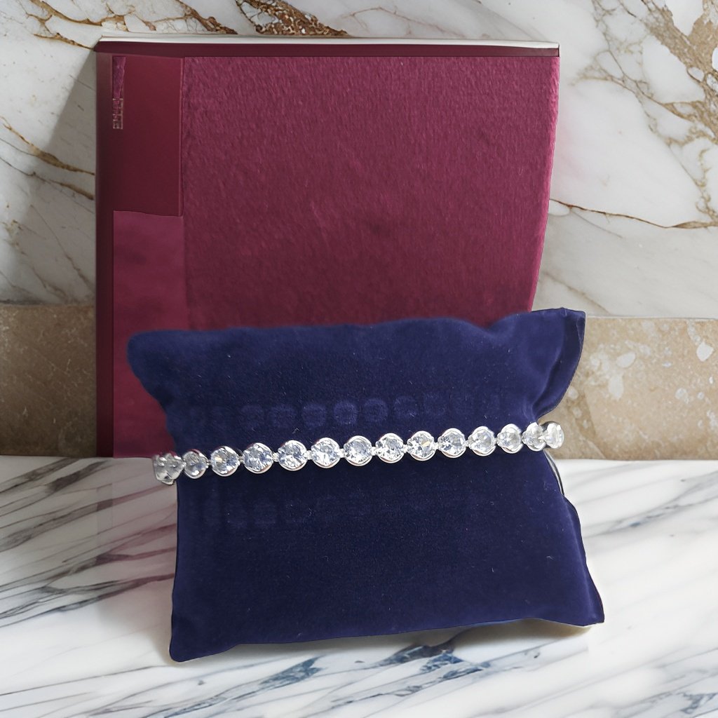 Make a fashion statement with our Circle Shaped Diamond Look Like Bracelet. With its eye-catching circular design and diamond-like details, this bracelet adds a touch of elegance to any look. The adjustable length ensures a comfortable fit, making it suitable for all occasions.