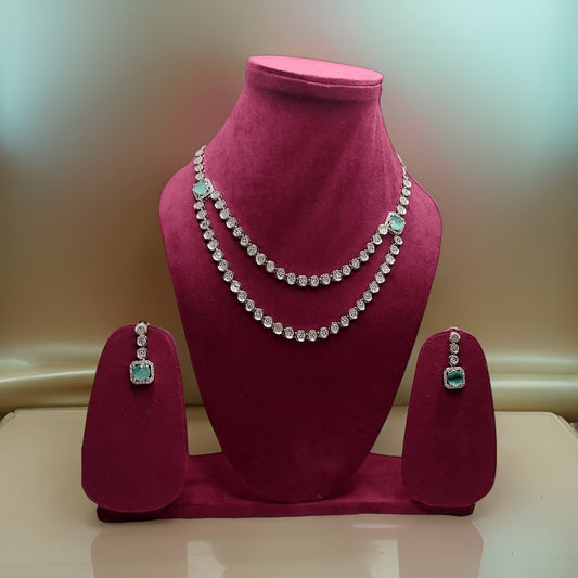 Elevate your look with our Crystal Tassel Multi Layer American Diamond Necklace. This elegant piece features multi-layered chains with crystal tassel accents for a glamorous look. The adjustable length ensures a perfect fit, making it suitable for all necklines.