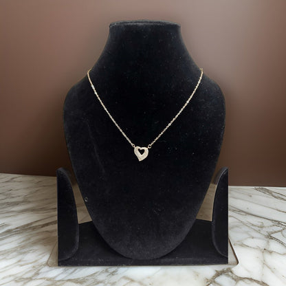 Add a touch of romance to your look with our <em>Elegant Heart Pendant</em>. This stunning piece features an elegant heart-shaped pendant that symbolizes love and affection. The adjustable chain ensures a comfortable fit, making it suitable for all occasions.