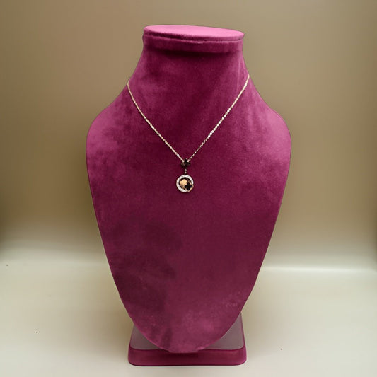Elevate your style with our Gold Color Circle Pendant. This chic piece features a circular pendant with a luxurious gold finish that adds a touch of glamour to any ensemble. The adjustable chain ensures a comfortable fit, making it suitable for all occasions.