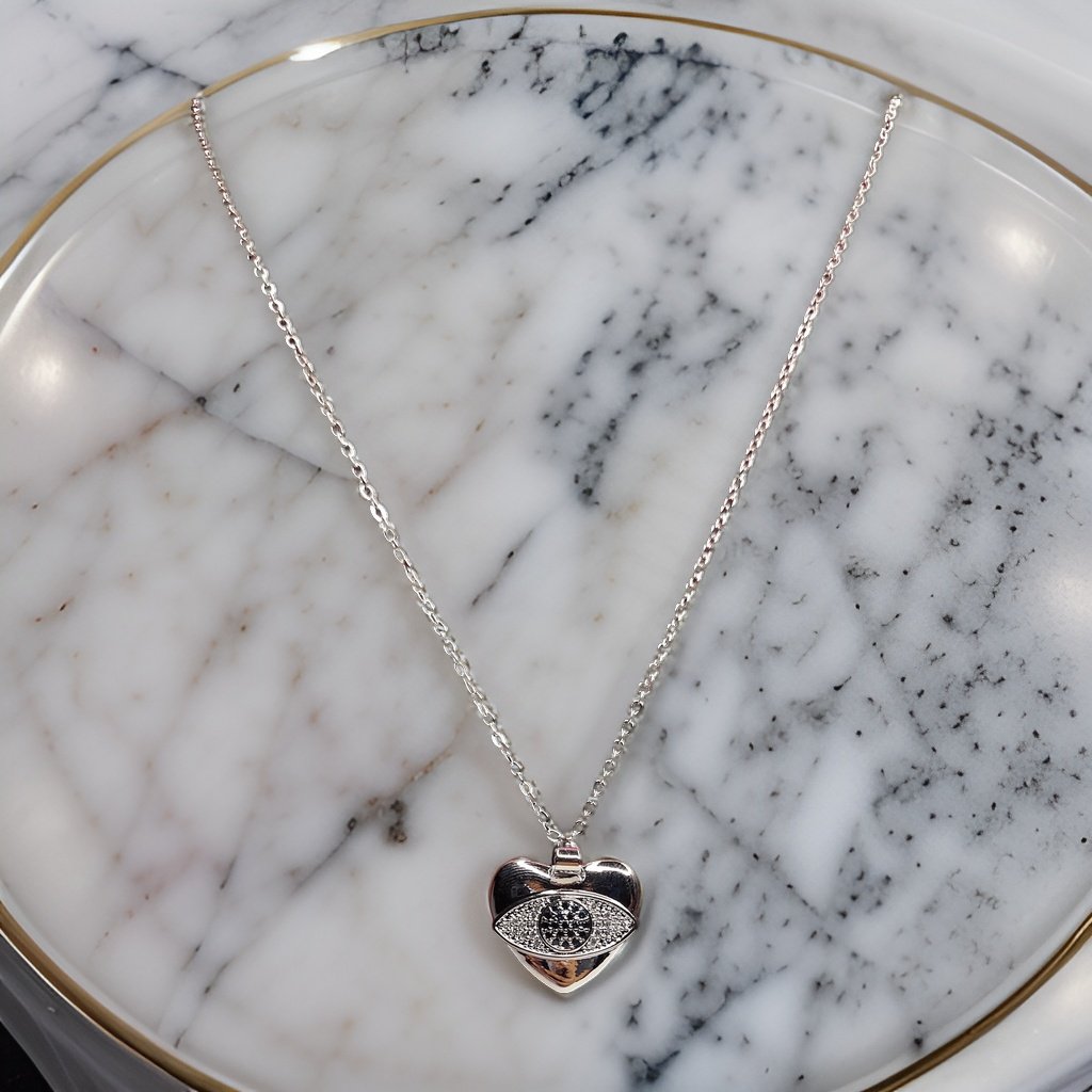 Add a touch of romance to your look with our Heart Pendant. This sweet piece features a heart design that symbolizes love and affection. The adjustable chain ensures a comfortable fit, making it suitable for all necklines.
