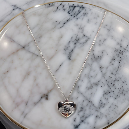 Add a touch of romance to your look with our Heart Pendant. This sweet piece features a heart design that symbolizes love and affection. The adjustable chain ensures a comfortable fit, making it suitable for all necklines.