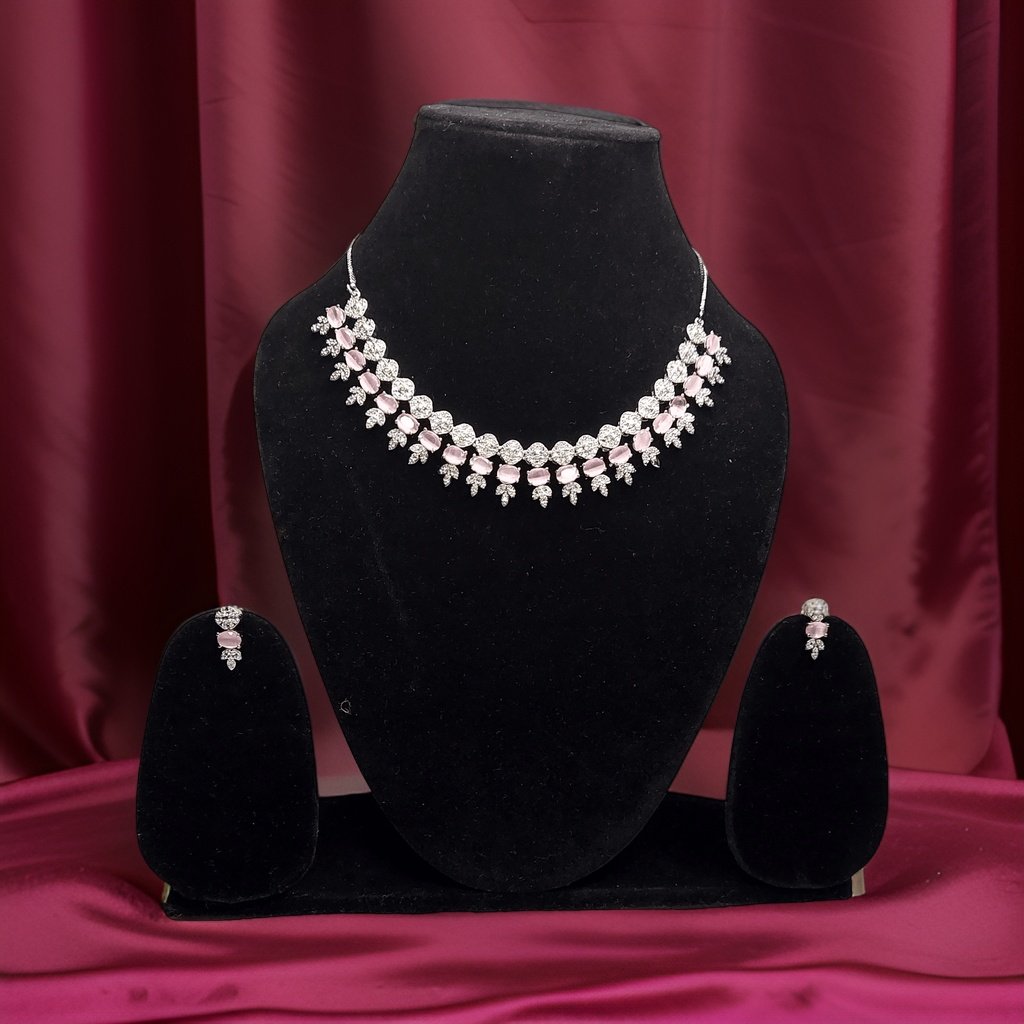 Add a pop of color to your ensemble with our Pink Stylish American Diamond Necklace. This stylish piece features sparkling pink American diamond accents that catch the light beautifully. The adjustable length ensures a comfortable fit, making it suitable for all occasions.