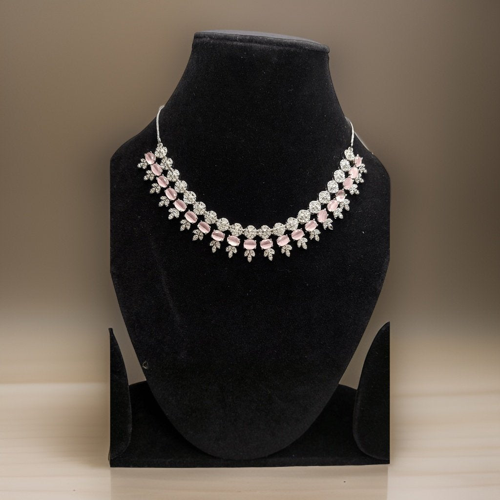 Add a pop of color to your ensemble with our Pink Stylish American Diamond Necklace. This stylish piece features sparkling pink American diamond accents that catch the light beautifully. The adjustable length ensures a comfortable fit, making it suitable for all occasions.