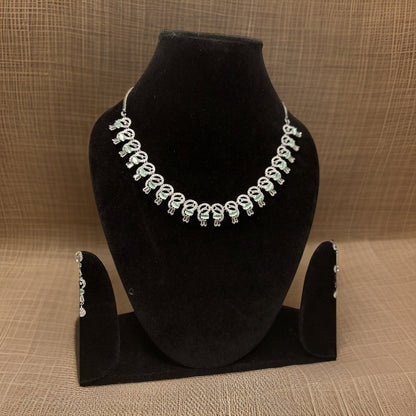 Elevate your look with our Premium American Diamond Necklace. This luxurious piece features high-quality American diamond accents that add instant glamour to any ensemble. The adjustable chain ensures a perfect fit, making it suitable for all necklines.