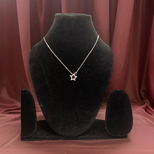 Shine bright with our Star Gold Color Pendant. This dazzling piece features a star-shaped pendant with a radiant gold finish that adds a celestial touch to any ensemble. The adjustable chain ensures a comfortable fit, making it suitable for all occasions.