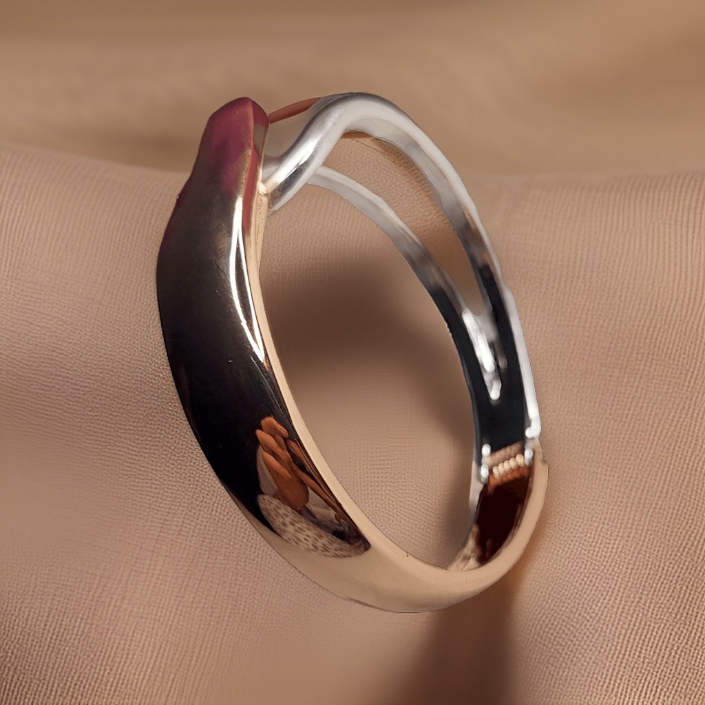 Add a touch of glamour to your ensemble with our Sterling Silver and Golden Look Bracelet. This versatile accessory features a combination of sterling silver and golden accents for a chic look. The adjustable length ensures a comfortable fit, making it suitable for all occasions.